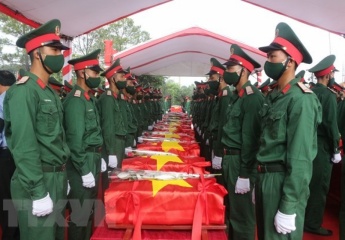 Remains of martyrs repatriated from Laos reburied in Nghe An, Thanh Hoa